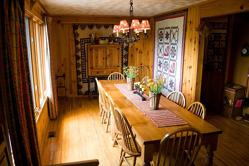 A long dining table set for a large family gathering