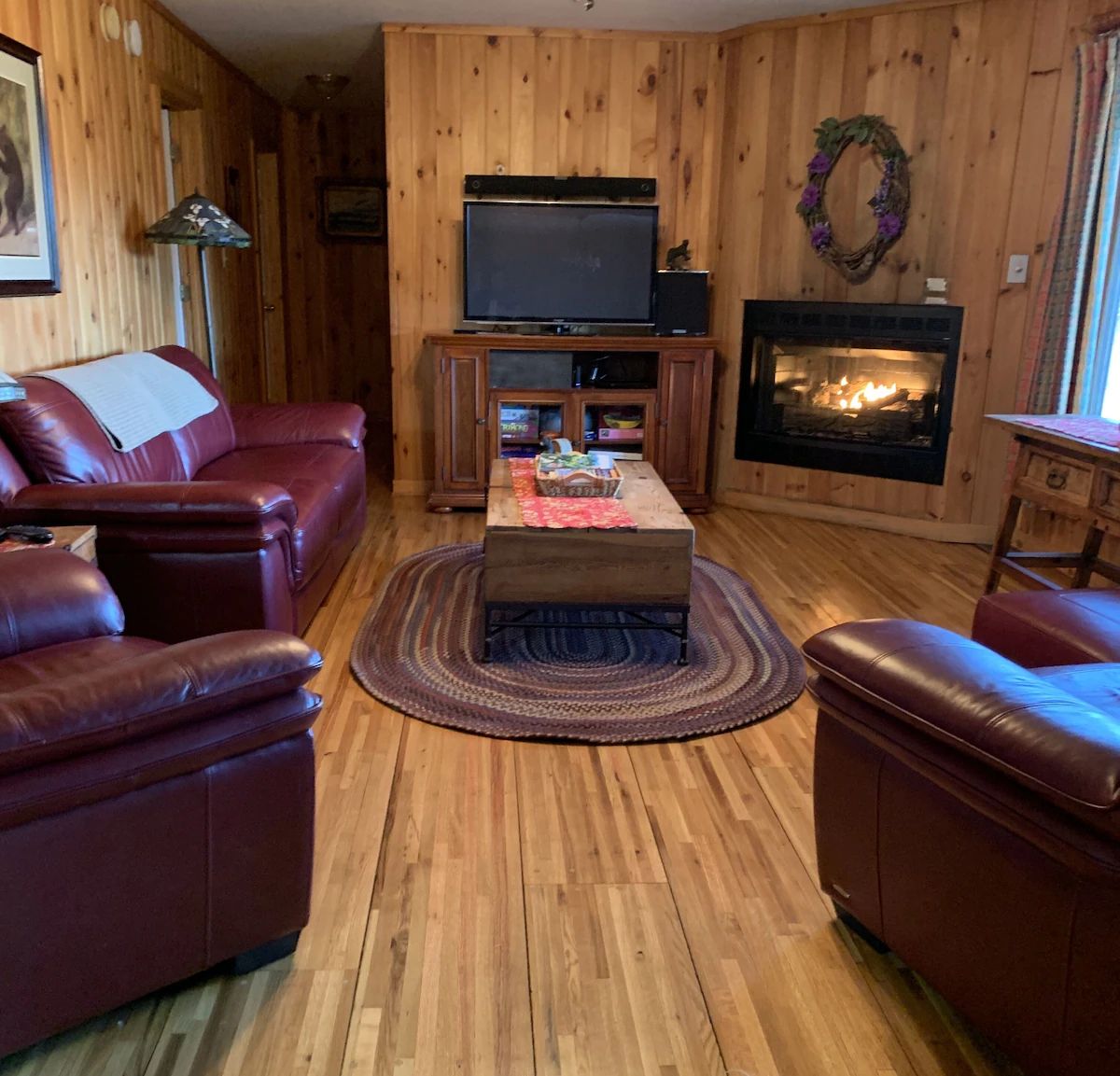 The great room with comfortable seating and warm wood ceilings